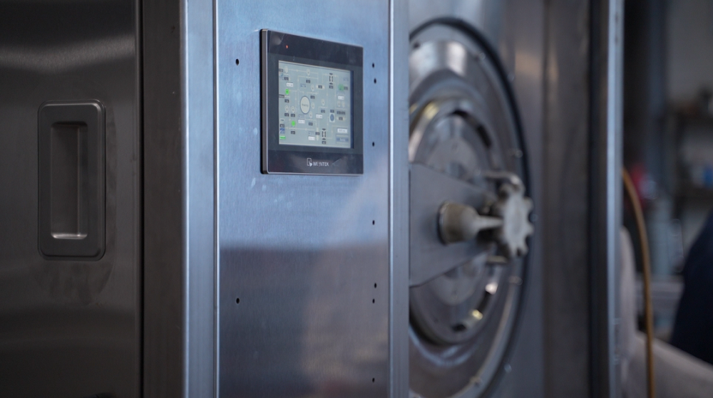 Ученые «Росатома» завершили испытания технологии безводной дезактивации спецодежды на экспериментальной установке 